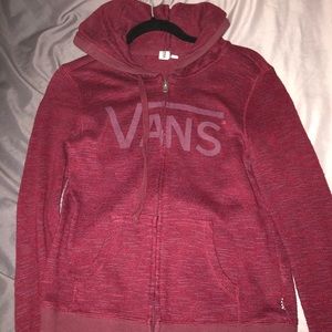 Burgundy zip up hoodie.